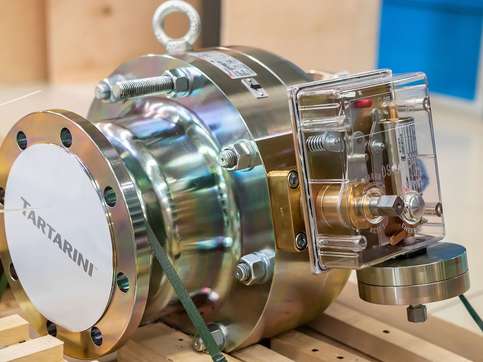 A stainless steel pump on a workbench
