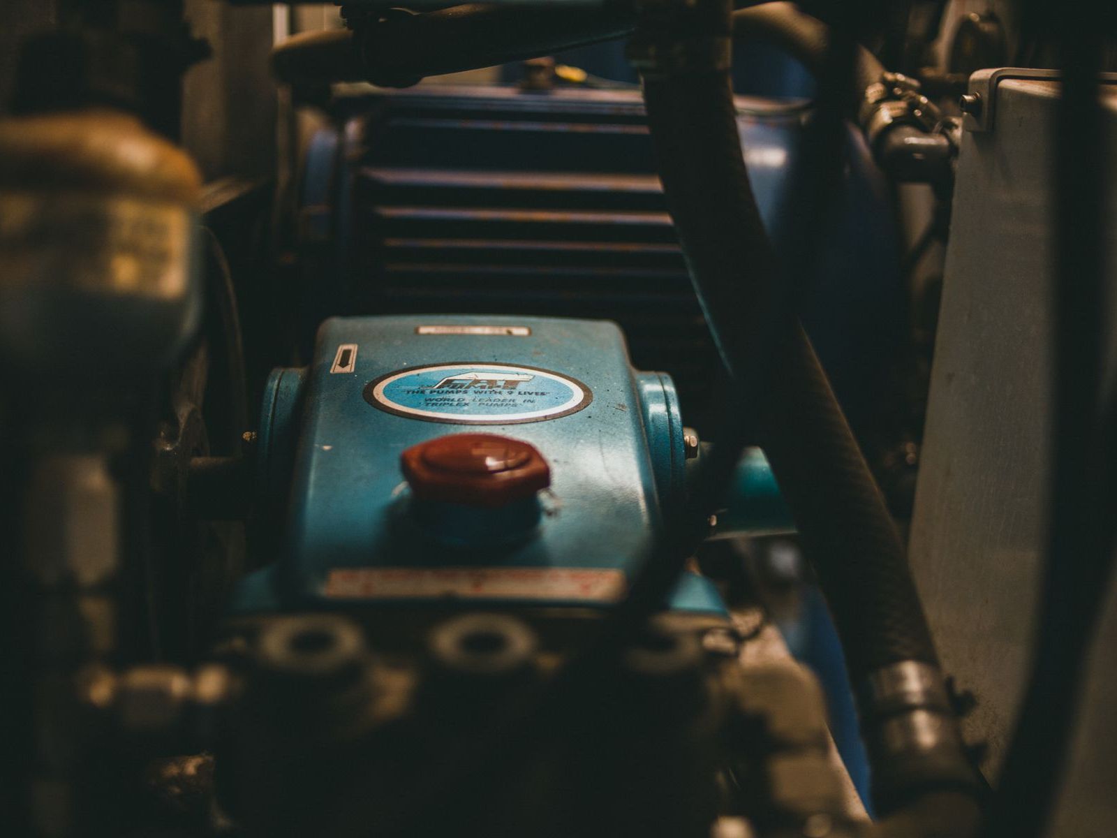 An electric motor in low light inside a machine